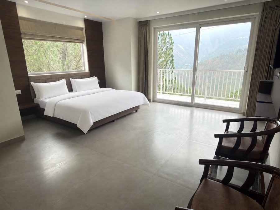 Hotel Pineora room with panoramic mountain and pine forest views