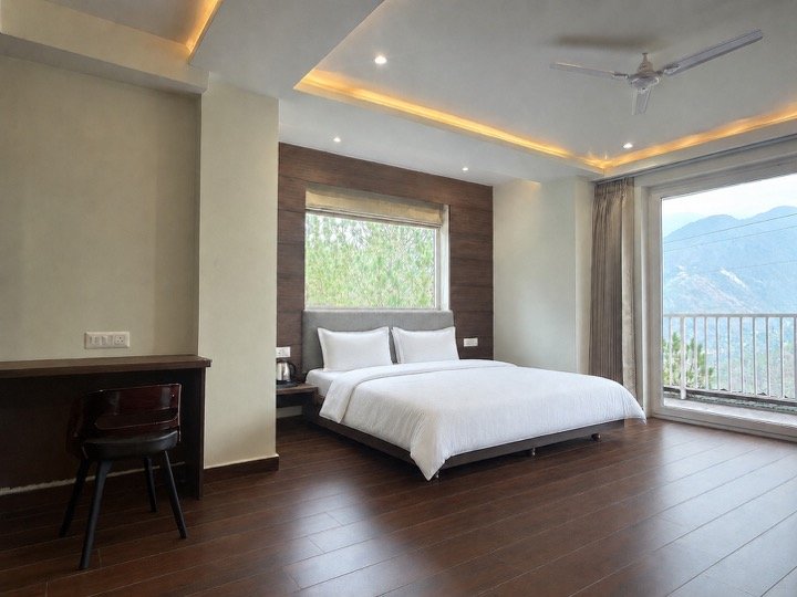 Mountain-facing guest room at Hotel Pineora Dalhousie